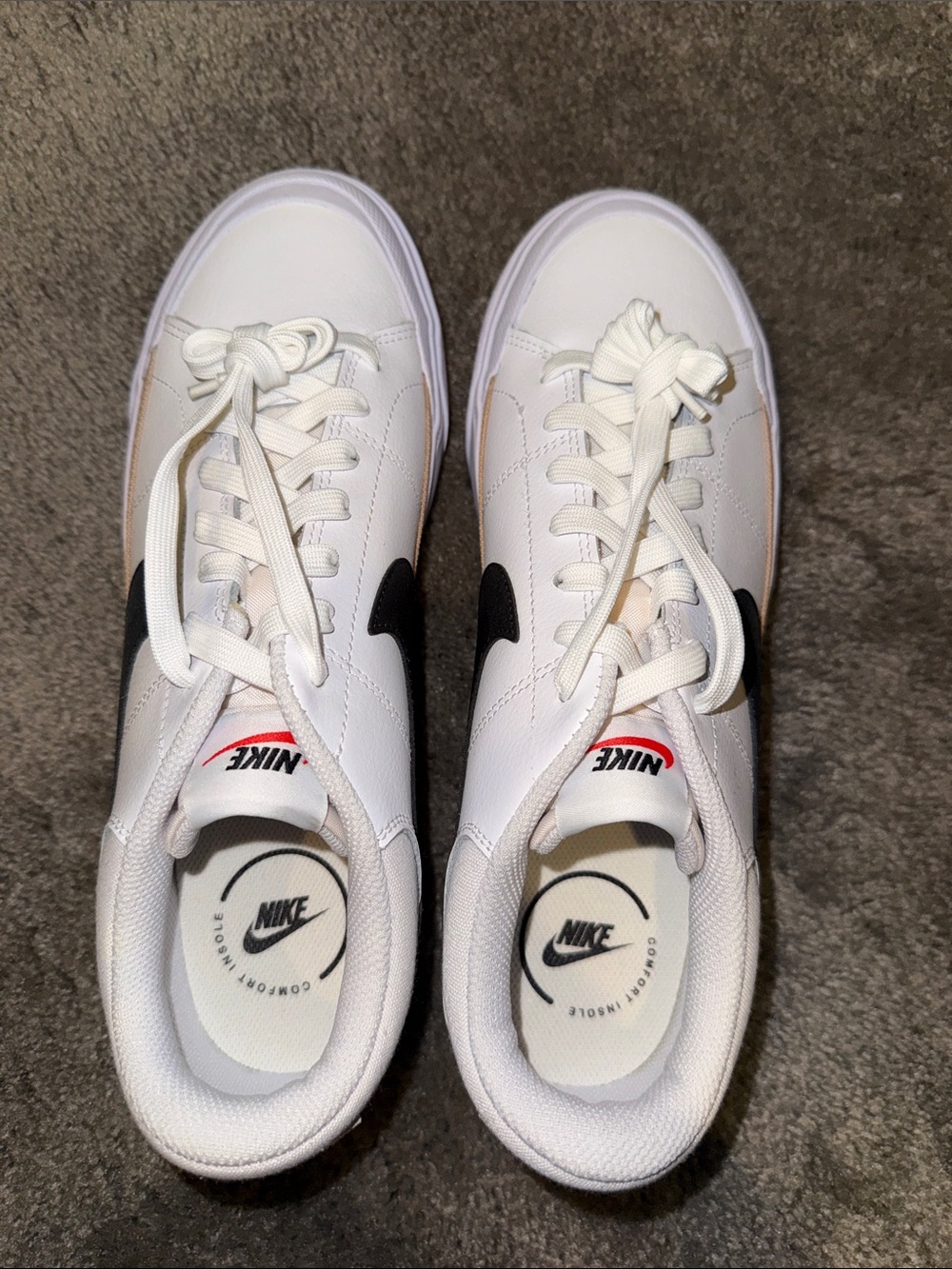 Nike Women's White Sneakers with Black Swoosh